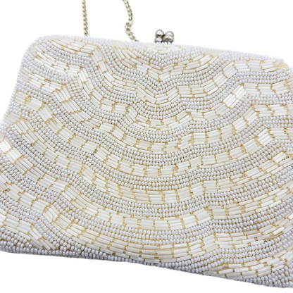 White beaded clutch bag on a white background