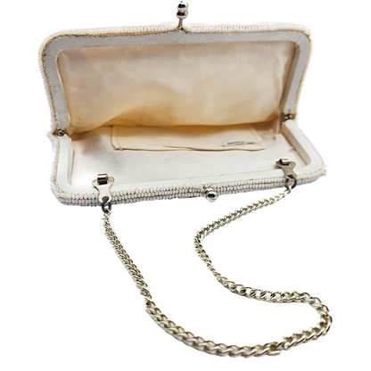 Open satin lined interior view vintage beaded evening bag made in japan label and silver chain 